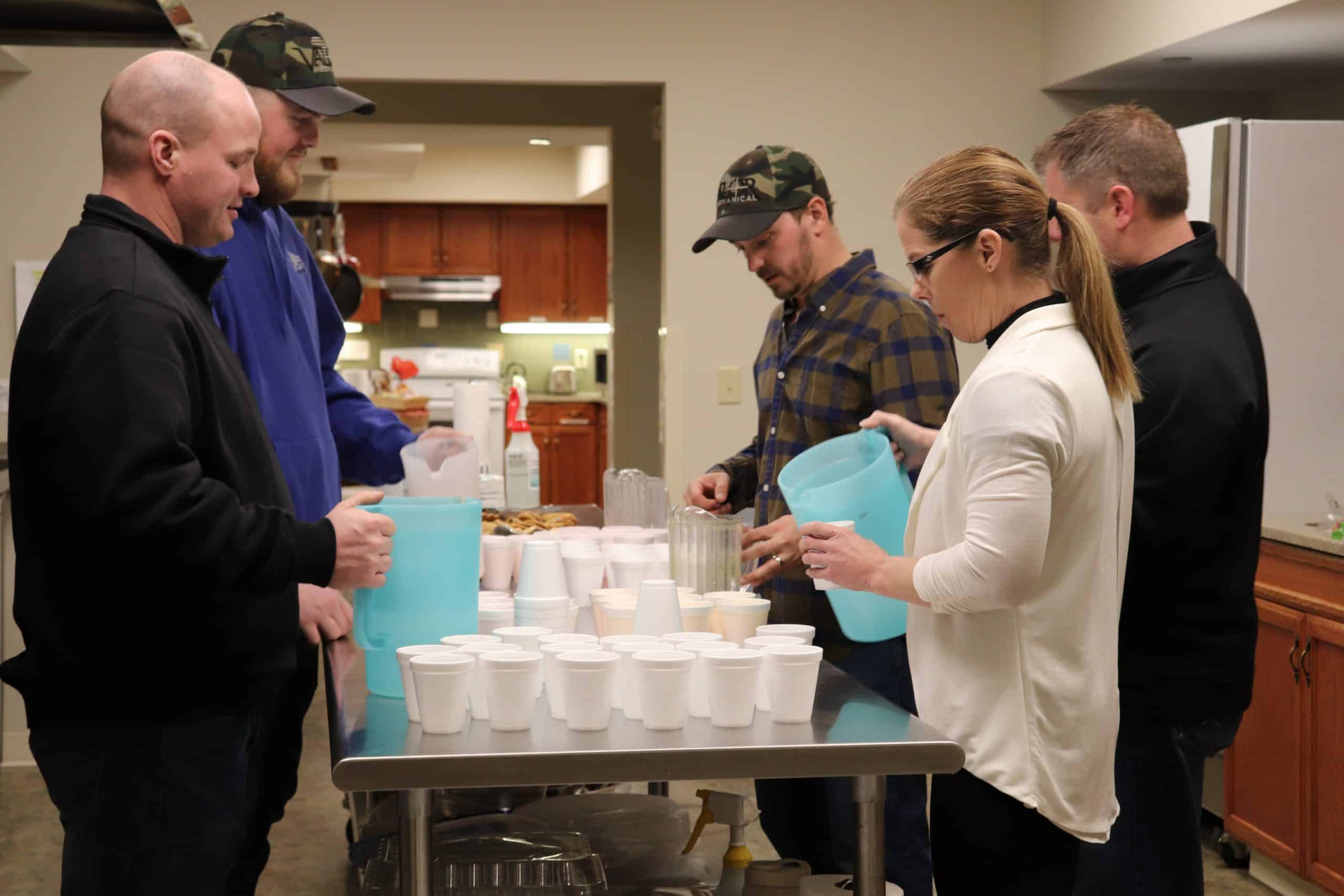 Volunteers pouring water
